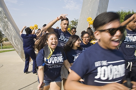 UC Merced students start the academic year by walking through "Beginnings" a sculpture.