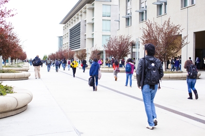 Students walk along Scholars Lane at UC Merced. 