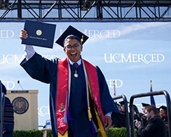 An excited graduate at commencement.