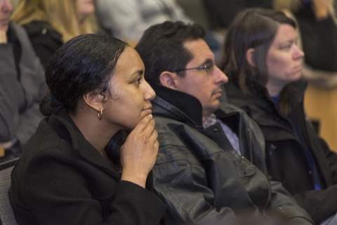 Staff members listen attentively during the Annual Staff Meeting.