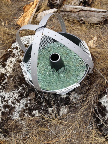 Bundt cake pans filled with marbles collected dust samples in the Sierra.