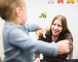 Professor Rose Scott pictured with a toddler.