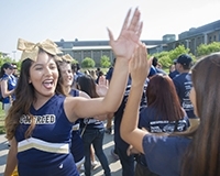 Students congratulate each other during the annual bridge crossing.