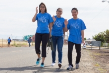 Three people take a stroll during the UC Walks event at UC Merced.