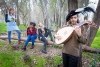UC Merced Professor Katherine Brokaw rehearses outdoors in the woods with student performers. 