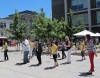 Chancellor Leland and a group of staff members do the Electric Slide during the staff picnic.