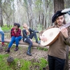 UC Merced Professor Katherine Brokaw rehearses outdoors in the woods with student performers. 
