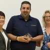 2016 Excellence Award winner Mort Peyvandi, center, stands between Chancellor Dorothy Leland and Staff Assembly President Pam Taylor.