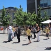 Chancellor Leland and a group of staff members do the Electric Slide during the staff picnic.