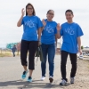 Three people take a stroll during the UC Walks event at UC Merced.