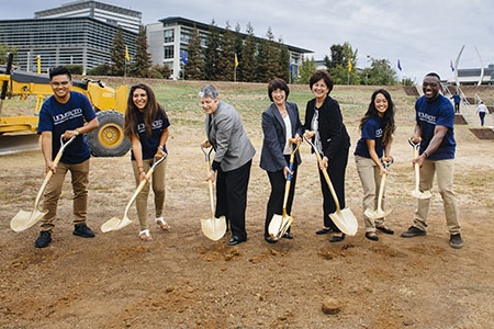UC President Janet Napolitano (center left), UC Merced Chancellor Dorothy Leland (center) and UC Board of Regents Chairwoman Monica Lozano (center right) and UC Merced students ceremonially break ground to kick off the Merced 2020 Project.