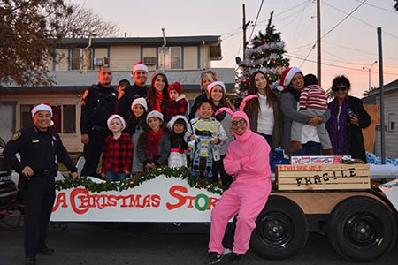 Members of the UC Merced Police Department and their family members, pictured on their holiday float.