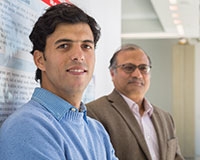Mehdi Bahrami, left, and Professor Mukesh Singhal work in the Cloud Lab.