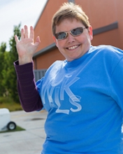Angi Baxter waves as she takes a stroll during the UC Walks event in May.