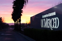View of the UC Merced sign at sunset