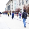 Students are shown walking on Scholars Lane at UC Merced.